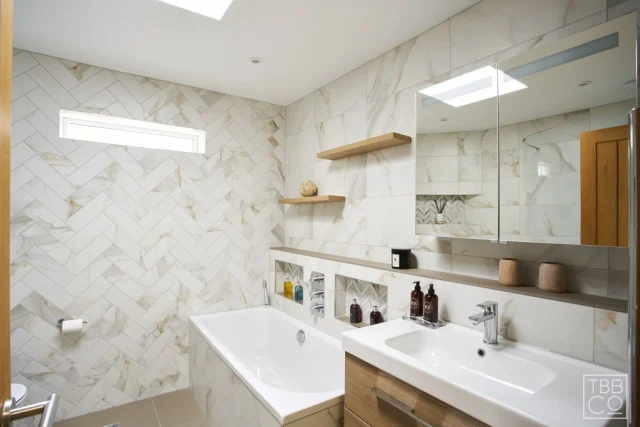 Elevate your bathroom design by using different shaped tiles to add depth to your space. These stunning marble tiles paired with the chevron style create a sense of luxury. Mixing tile shapes throughout your bathroom is a great way to add a subtle feature wall without overpowering the whole room, making it the perfect place to relax. 

#marbletiles #bathroom #designideas #sussexbathrooms #brightonbathroom #tiledesign #chevrontiles #bathroomrenovation #bathroominspiration