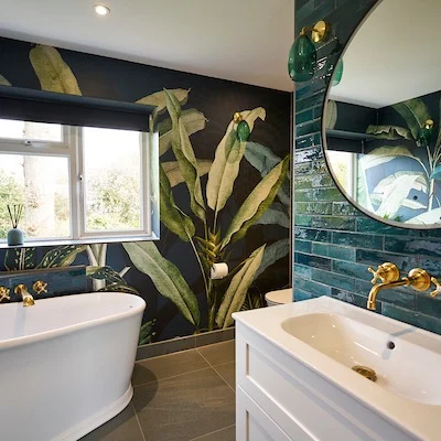 Bringing the outside in 🌿

We absolutely love the bold, tropical feel of this rainforest-inspired bathroom design. From the lush botanical wallpaper to the deep green tiles and statement brass fittings, every element works in harmony to create a space that feels immersive, luxurious and refreshing.

Perfectly balanced with a freestanding bath and clean white vanity, this bathroom is a true escape from the everyday. If you’re dreaming of something bold and unique for your own home, we’d love to help bring your vision to life.

#RainforestBathroom #TropicalInteriors #BathroomInspo #BoldBathroomDesign #GreenBathroomTiles #JungleWallpaper #FreestandingBath #LuxuryBathrooms #StatementBathroom #BiophilicDesign #BotanicalStyle #BrassFittings #ModernBathrooms #BespokeBathrooms #BathroomGoals @thebrightonbathroomcompany @thebrightonbathroomco