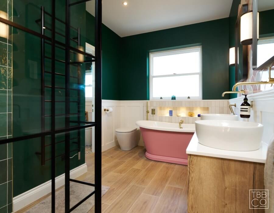 Pink painted bath Black shower enclosure Green painted walls Timber bathroom vanity in Balcombe
