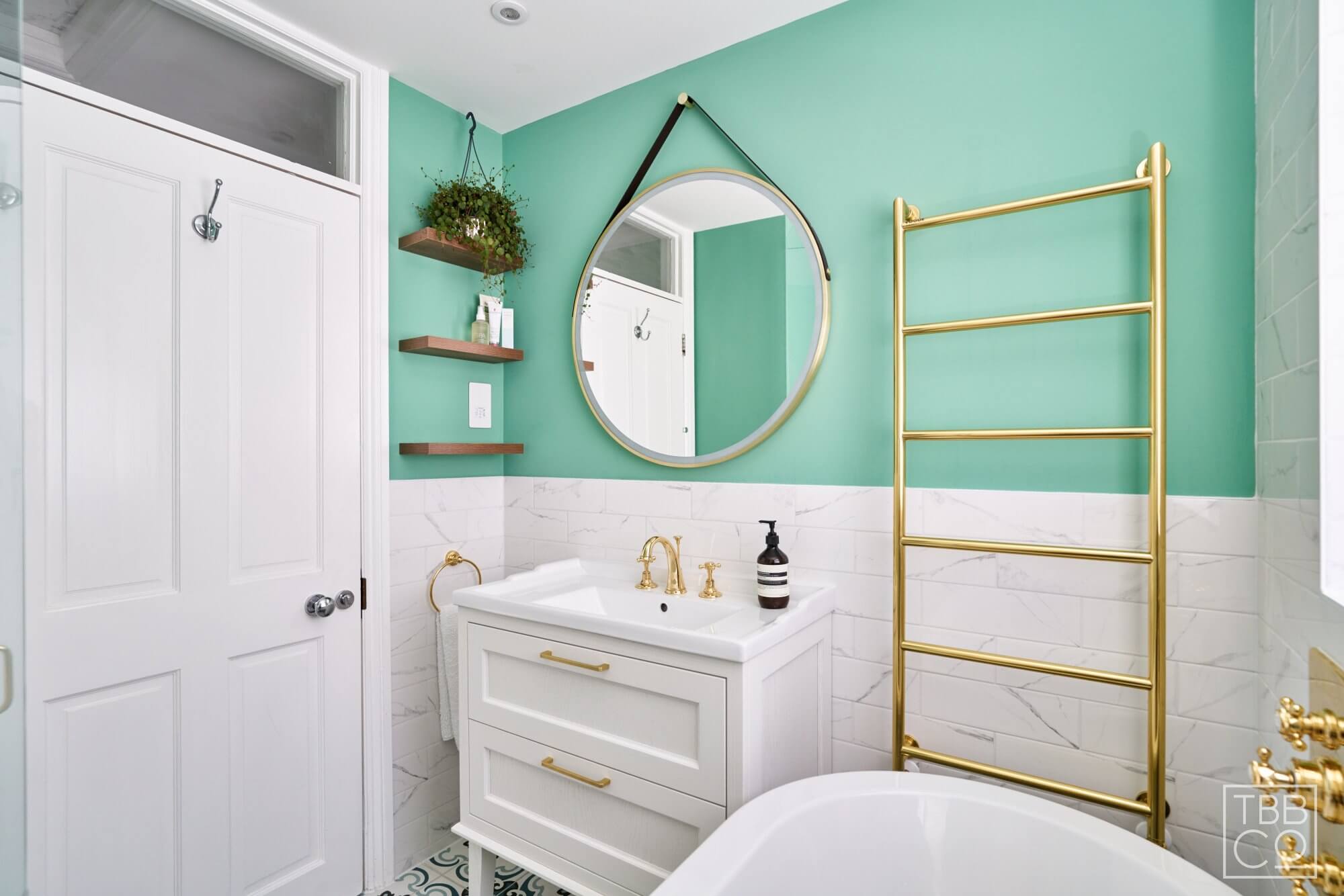 Floating Shelves and White Bathroom Vanity with Gold Handles