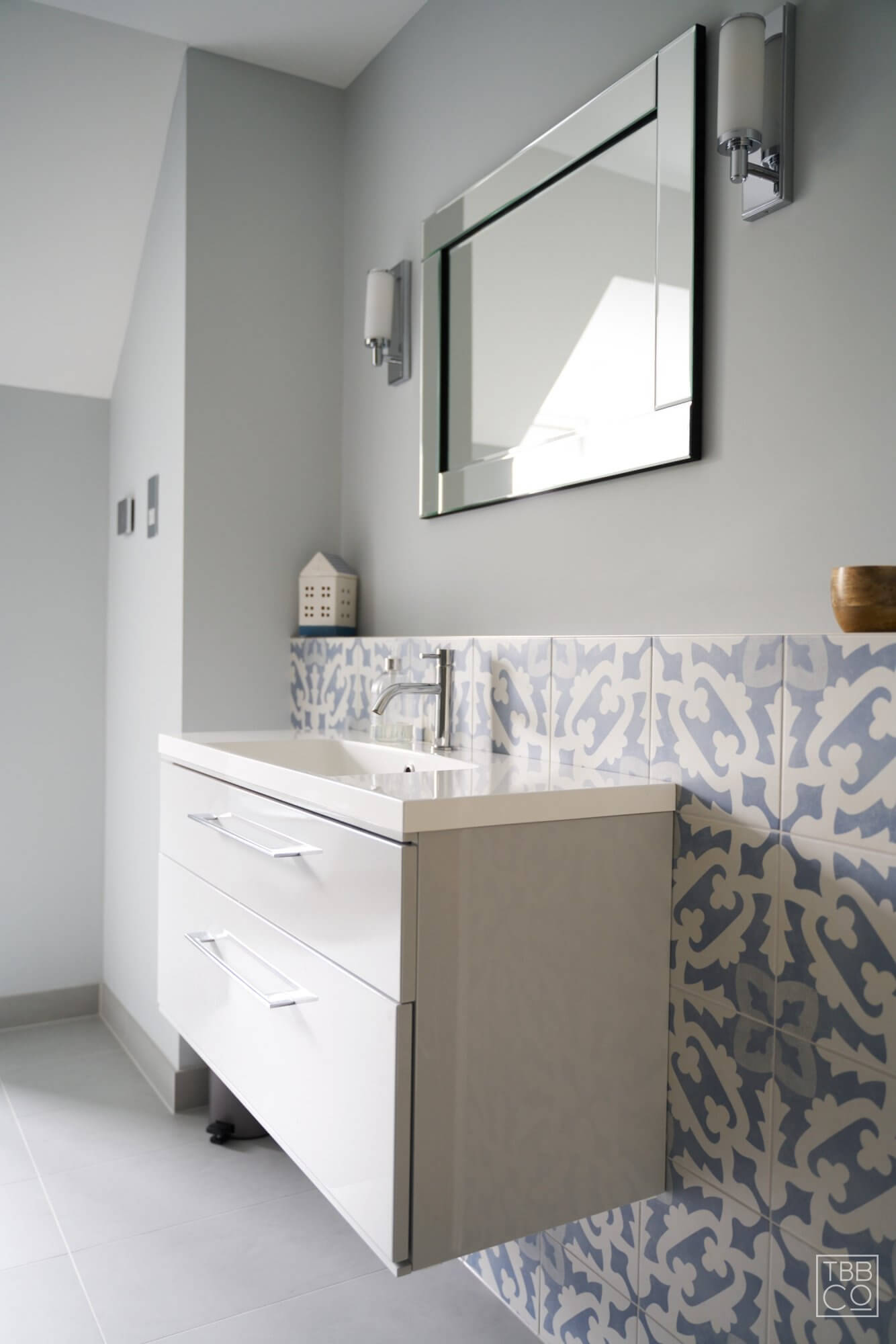 Bathroom Vanity with Patterned Tiles and Feature Mirror