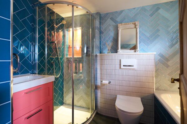Light Blue and Dark Blue Tiles and Pink Bathroom Vanity