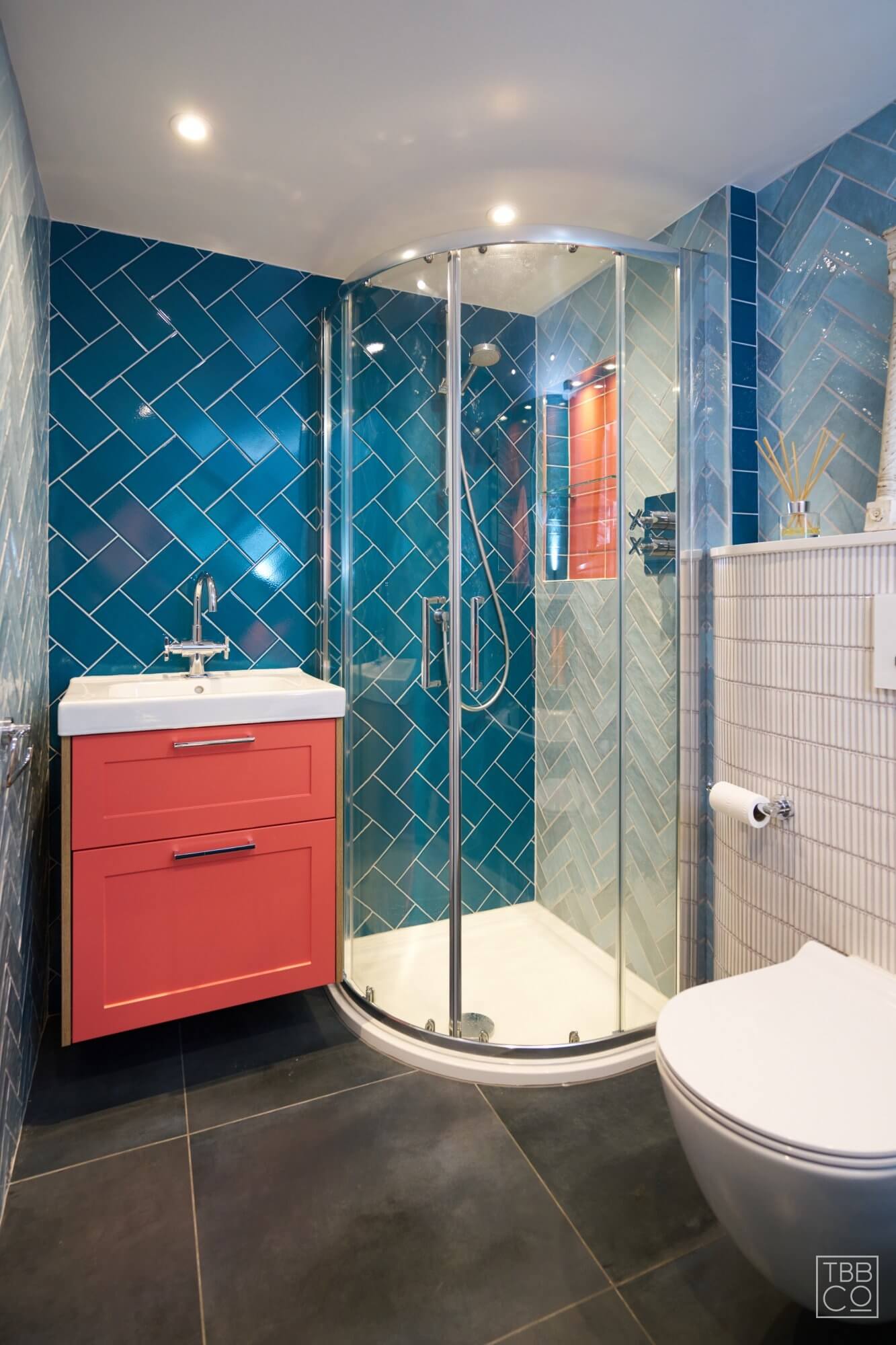 Pink Bathroom Vanity Unit and Blue Tiles