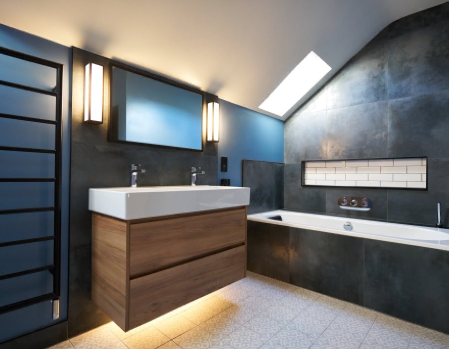 Bathroom design with dark tiles and black taps and shower enclosure