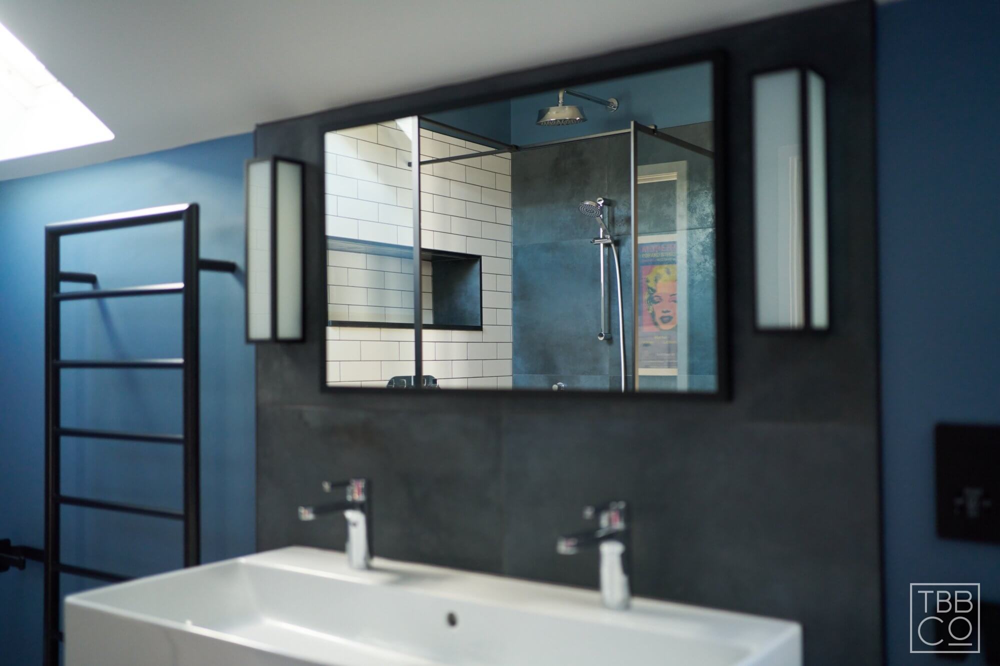 Black bathroom mirror with matching wall lights
