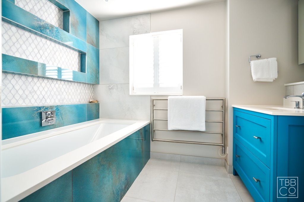 sea blue tiles and blue bathroom vanity