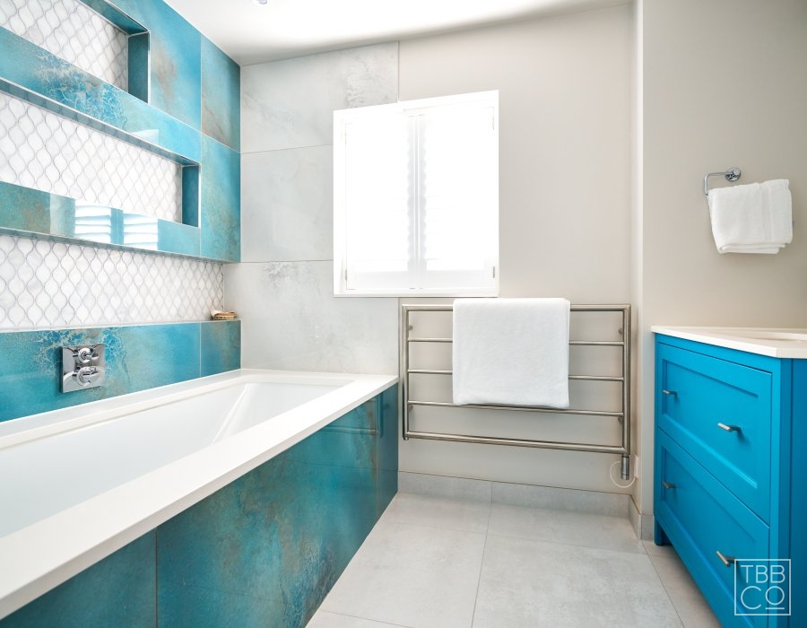 sea blue tiles and blue bathroom vanity