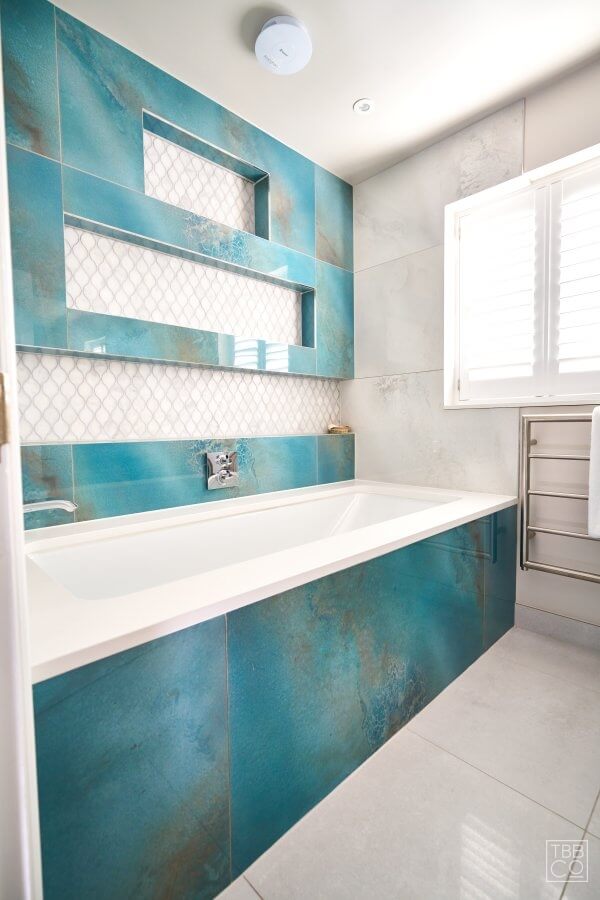 bath with sea tiles surround